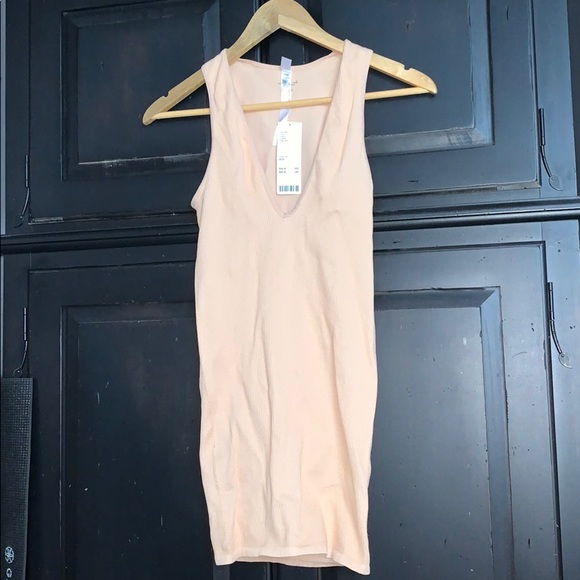 Nude out from under mini dress